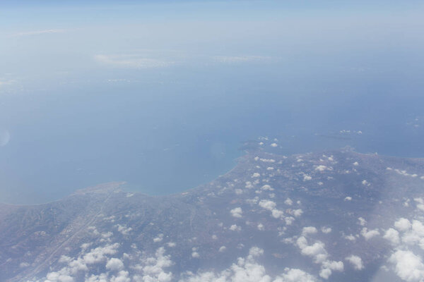 Aerial view of sea and coast of Catalonia with clouds in sky, Spain 