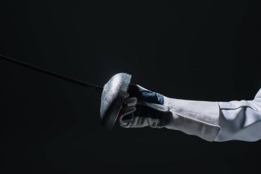 Cropped view of fencer in glove holding rapier isolated on black  clipart