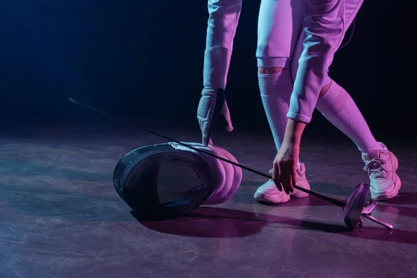 Cropped View Swordswoman Putting Fencing Mask Rapier Floor Black Background — Stock Photo, Image