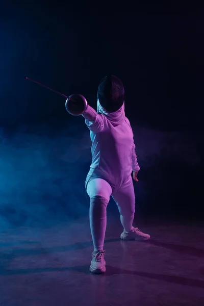 Fencer Doing Lunge While Training Rapier Black Background Smoke Lighting — Stock Photo, Image