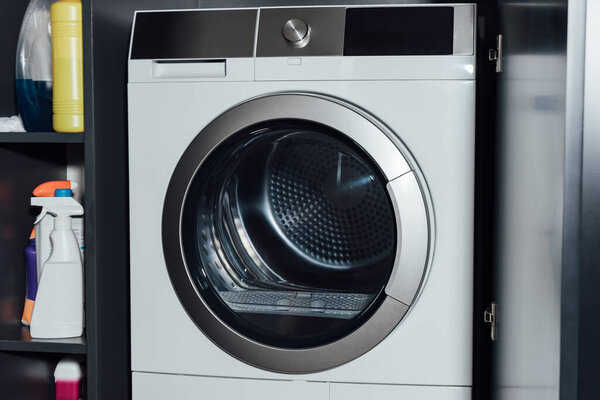 modern and white washing machine at home