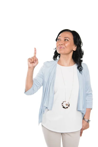 Lässige asiatische Frau zeigt mit dem Finger — Stockfoto