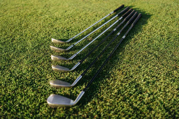 Golf clubs on grass — Stock Photo