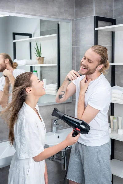 Young couple in bathroom in the morning — Stock Photo