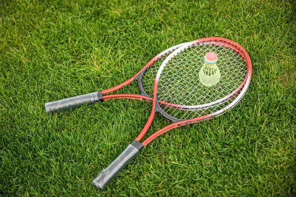 Badminton racquets and shuttlecock — Stock Photo