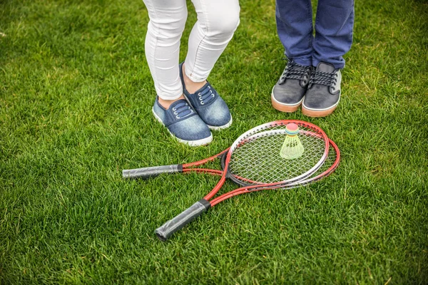 Children with badminton equipment — Stock Photo