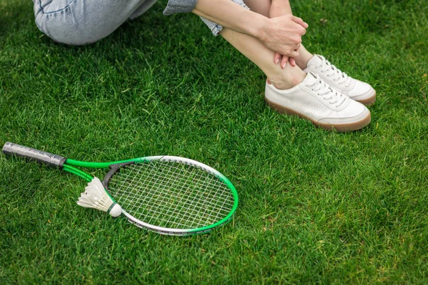 Woman and badminton equipment — Stock Photo