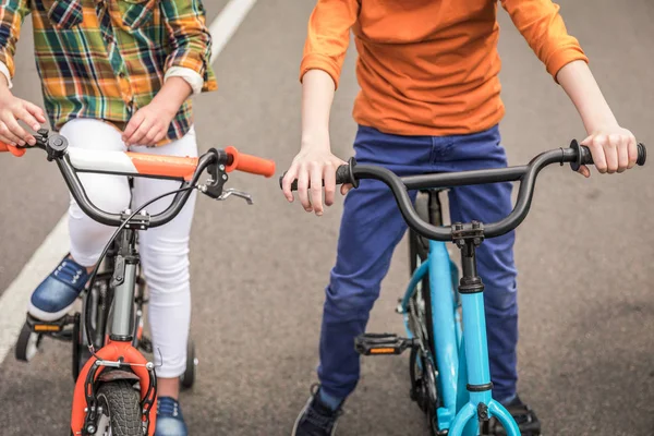 Kids riding bicycles — Stock Photo