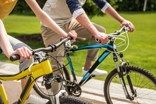 Couple riding on bicycles — Stock Photo