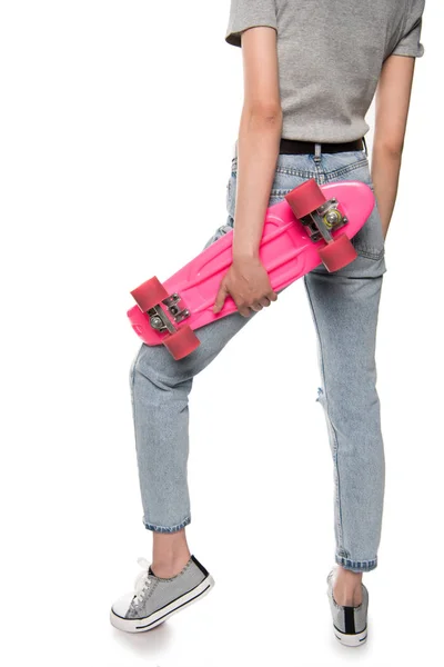 Young woman with skateboard — Stock Photo