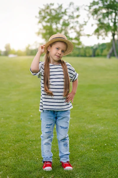 Cute girl in straw hat — Stock Photo