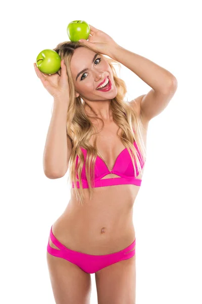 Mulher de biquíni com maçãs — Fotografia de Stock