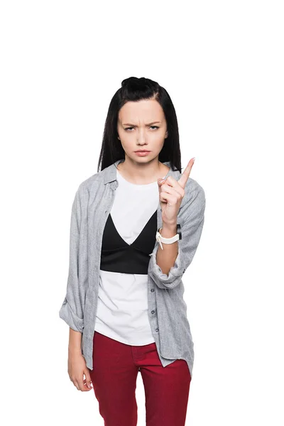 Serious girl pointing with finger — Stock Photo