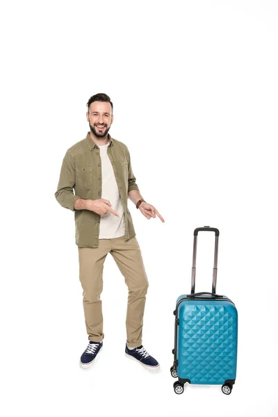 Hombre apuntando a la maleta — Stock Photo