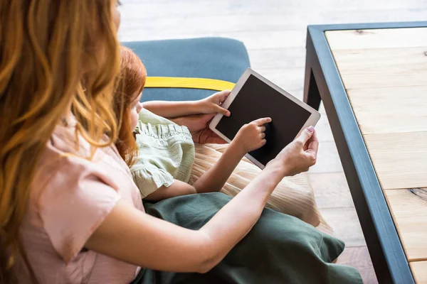 Mother and daughter with digital tablet — Stock Photo