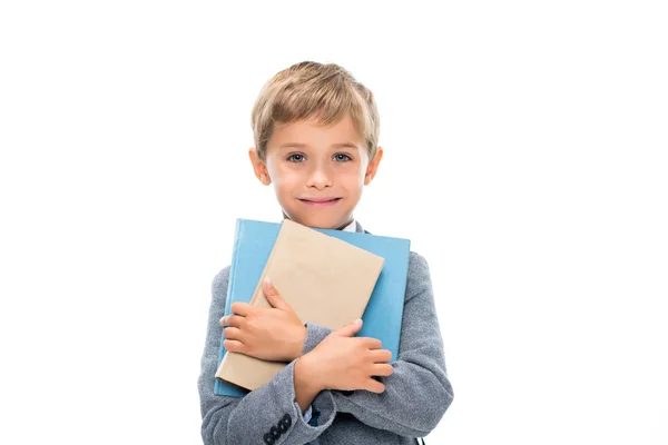 Menino feliz segurando livros — Fotografia de Stock