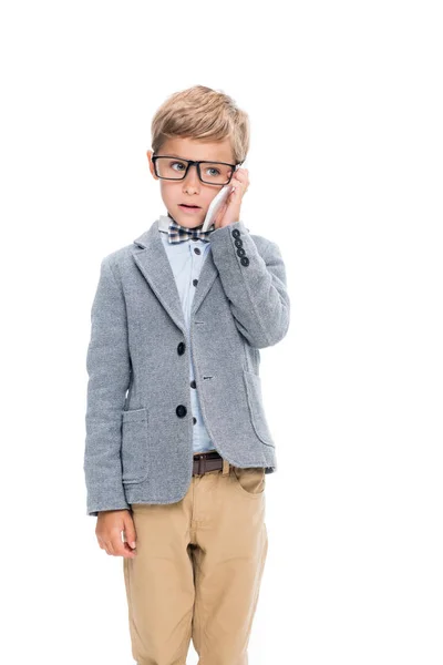 Schoolboy talking by phone — Stock Photo