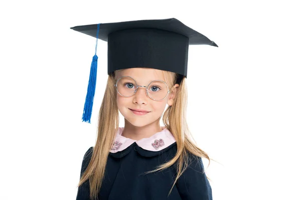 Little schoolgirl in graduation hat — Stock Photo