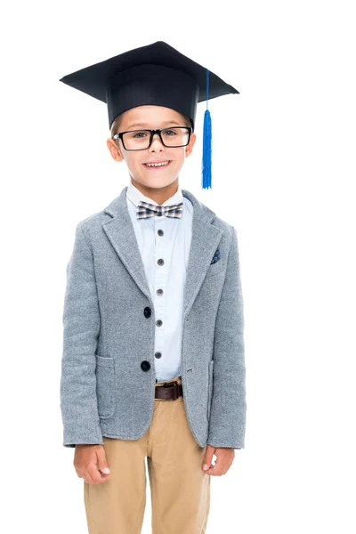 Happy schoolboy in graduation hat — Stock Photo