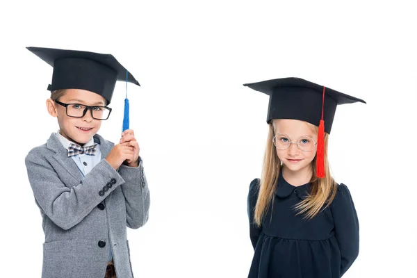 Pupils in graduation hats — Stock Photo