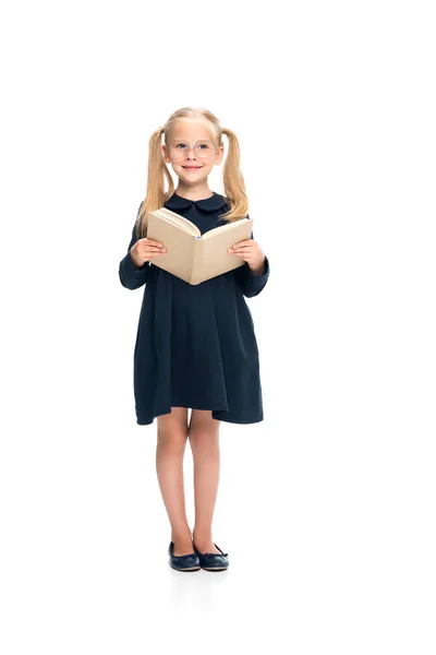 Colegiala sonriente con libro - foto de stock