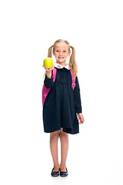 Colegiala sosteniendo manzana - foto de stock