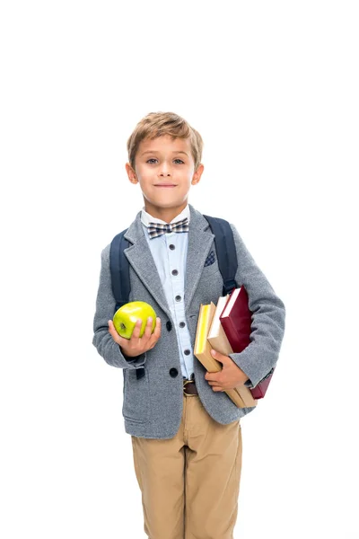 Schoolboy with books and apple — Stock Photo