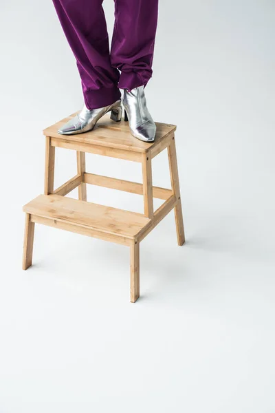 Woman in silver colored boots — Stock Photo