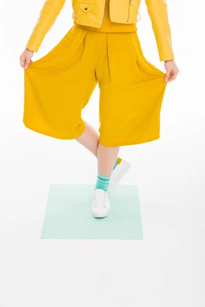 Fashionable girl in yellow clothes — Stock Photo