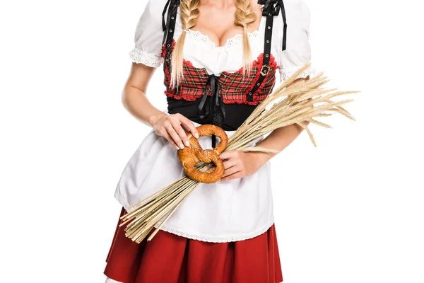 Girl with pretzel and wheat ears — Stock Photo