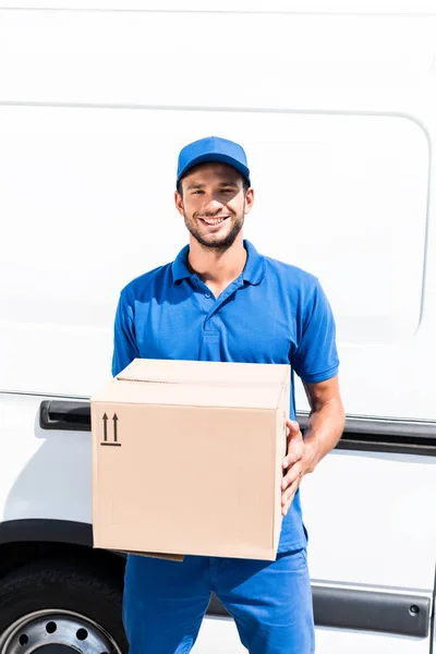 Delivery man with box — Stock Photo