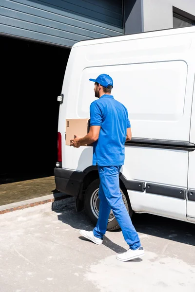 Delivery man with box — Stock Photo