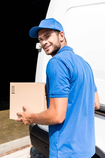 Delivery man with box — Stock Photo