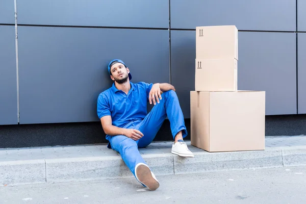 Exhausted delivery man — Stock Photo