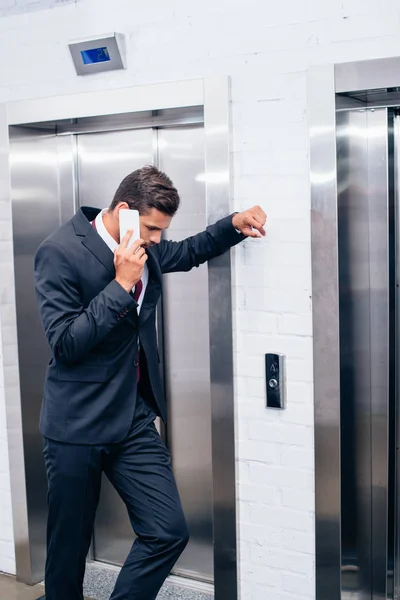 Businessman talking by phone — Stock Photo