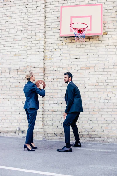 Business people playing basketball — Stock Photo