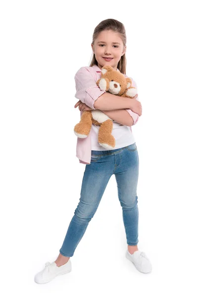 Petite fille étreignant ours en peluche — Photo de stock