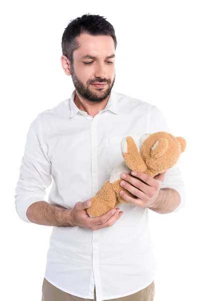 Homme tenant un ours en peluche — Photo de stock