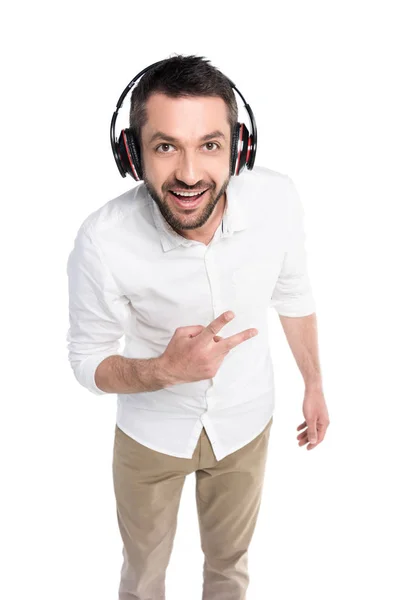 Man in headphones showing peace sign — Stock Photo