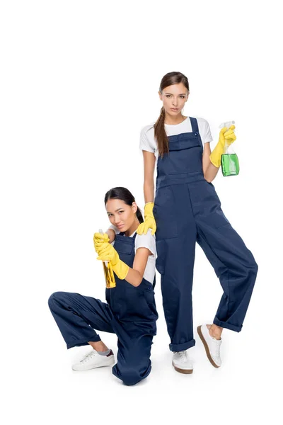 Multicultural cleaners with detergents — Stock Photo