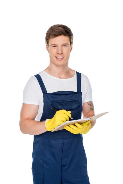 Pulitore sorridente con taccuino — Foto stock