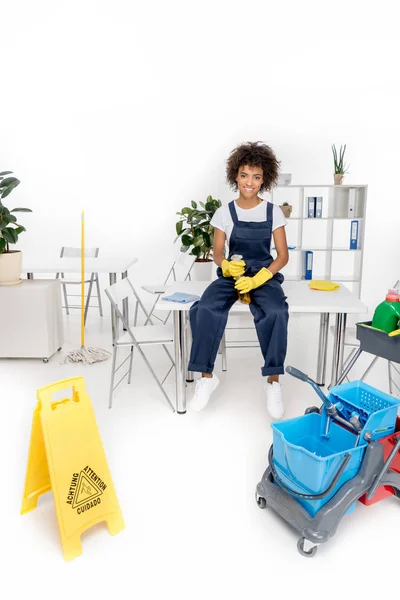 African american cleaner with spray bottle — Stock Photo