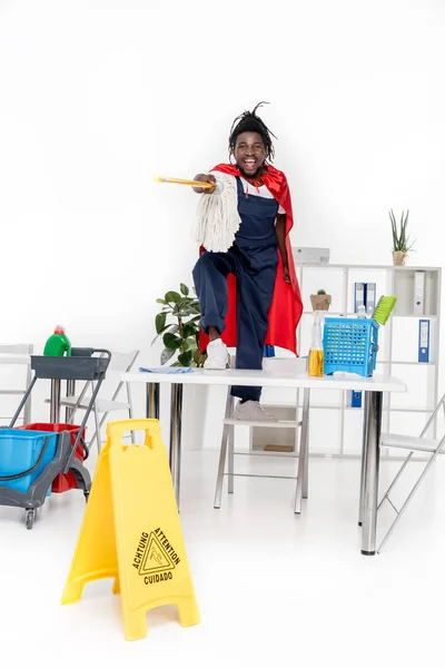 African american cleaner in superhero costume — Stock Photo