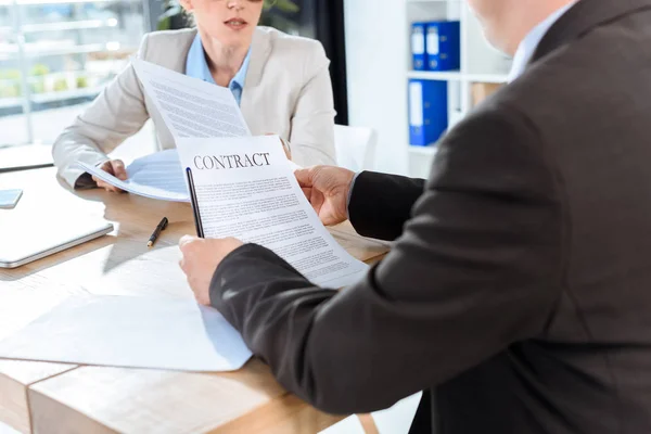 Colleagues discussing contract — Stock Photo