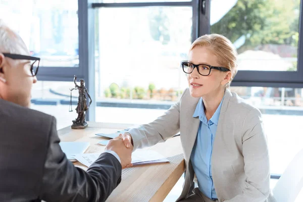 Business colleagues shaking hands — Stock Photo