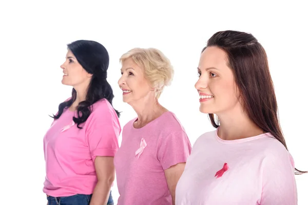 Women in pink t-shirts with ribbons — Stock Photo