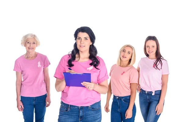 Women in pink t-shirts with ribbons — Stock Photo