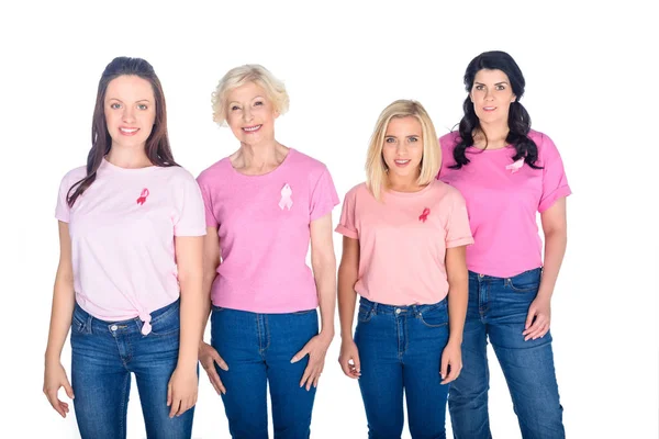 Women in pink t-shirts with ribbons — Stock Photo