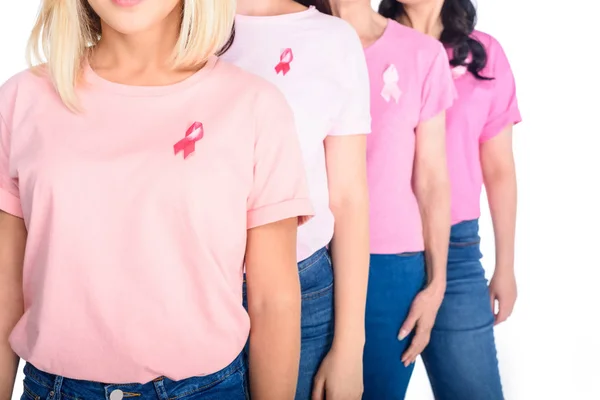 Women in pink t-shirts with ribbons — Stock Photo