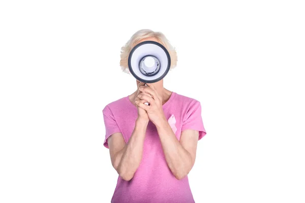 Senior woman with megaphone — Stock Photo